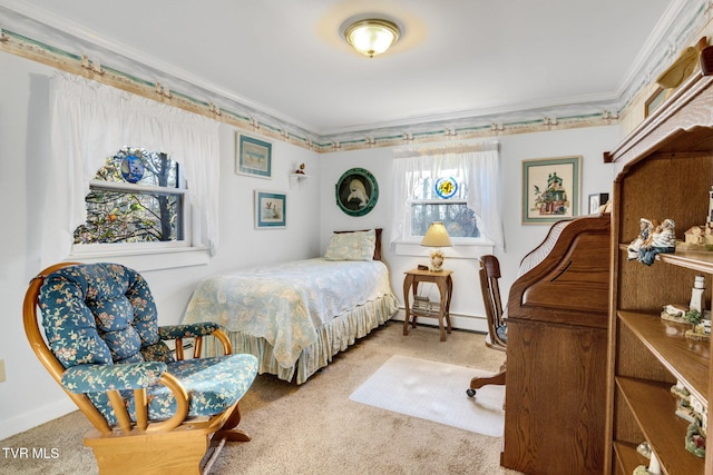 bedroom with carpet floors, a baseboard radiator, and crown molding