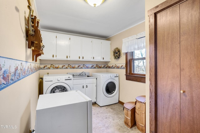 clothes washing area featuring cabinets, separate washer and dryer, sink, and ornamental molding