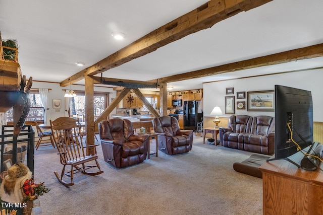 living room featuring beamed ceiling and light colored carpet