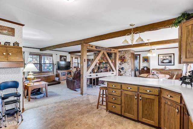 kitchen with light carpet, a kitchen breakfast bar, beam ceiling, an inviting chandelier, and hanging light fixtures