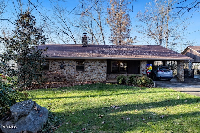 ranch-style house featuring a front yard and a carport