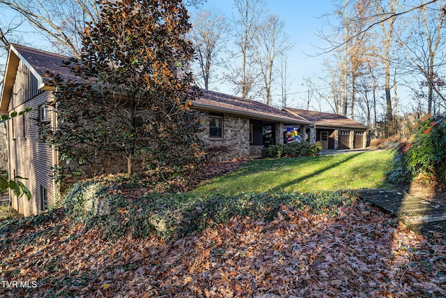 rear view of house featuring a lawn