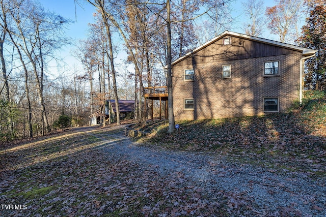 view of home's exterior featuring a deck