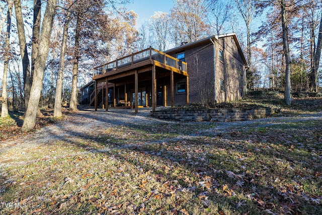 rear view of house with a wooden deck