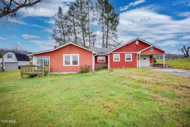 view of front of home with a front lawn, a garage, a deck, and a carport