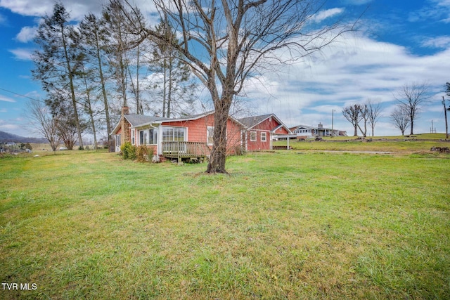 view of yard with a wooden deck