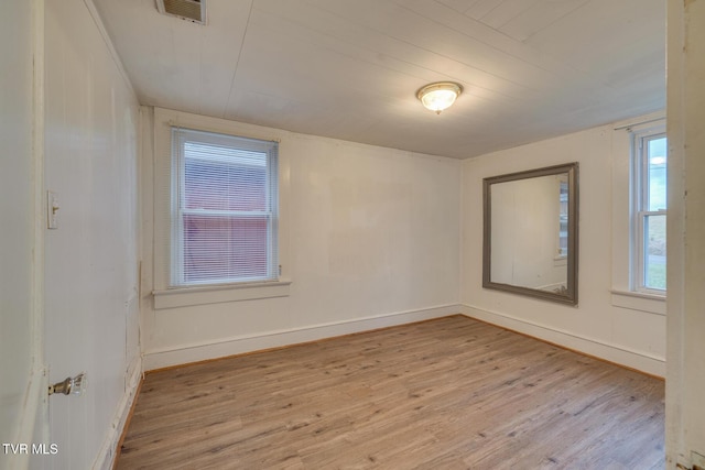 spare room featuring light wood-type flooring