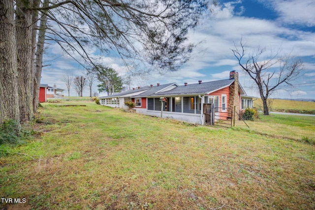 view of yard with a sunroom