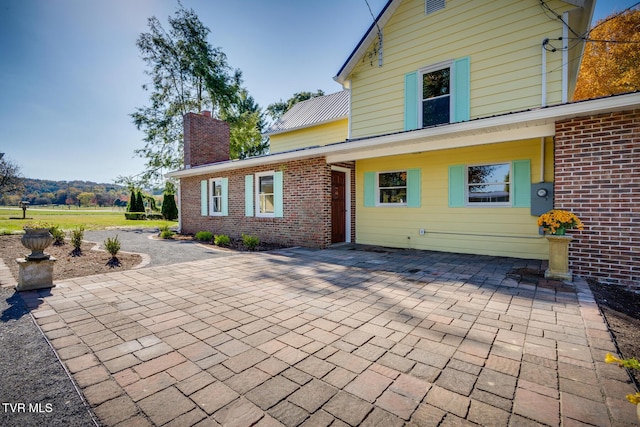 rear view of house featuring a patio area