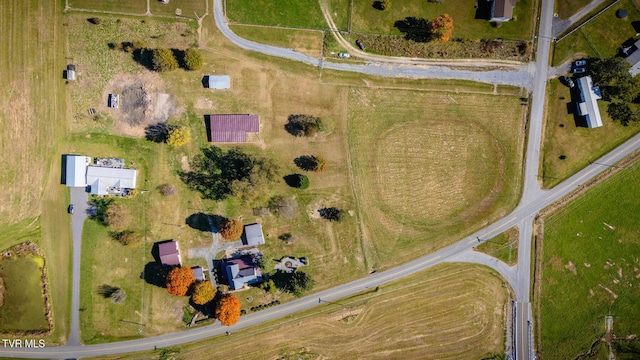 birds eye view of property with a rural view