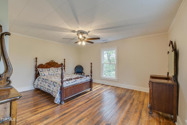 bedroom with dark hardwood / wood-style floors, ceiling fan, and ornamental molding