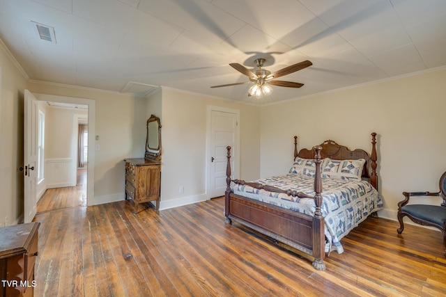 bedroom with ornamental molding, ceiling fan, and dark wood-type flooring