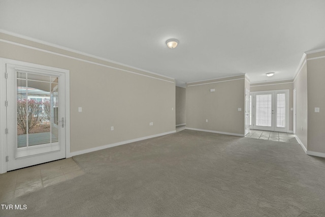 unfurnished living room with light carpet, french doors, and crown molding