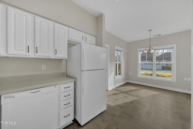 kitchen featuring white cabinetry, white appliances, and hanging light fixtures