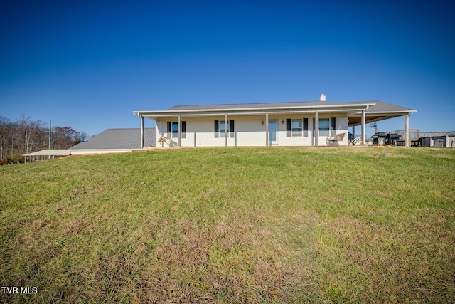 view of front of property with covered porch and a front yard