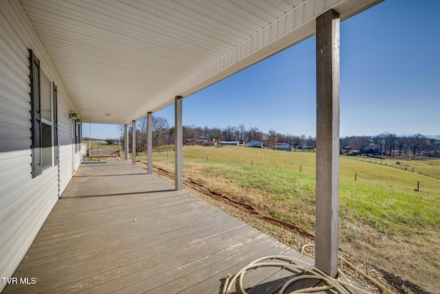 wooden terrace with a rural view