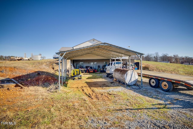 exterior space with a garage and a carport