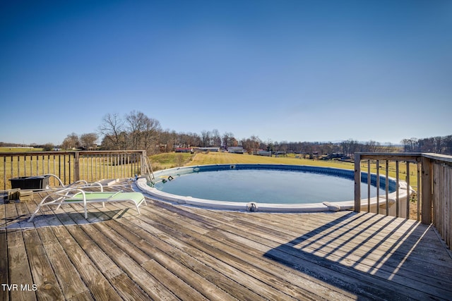 view of pool with a wooden deck