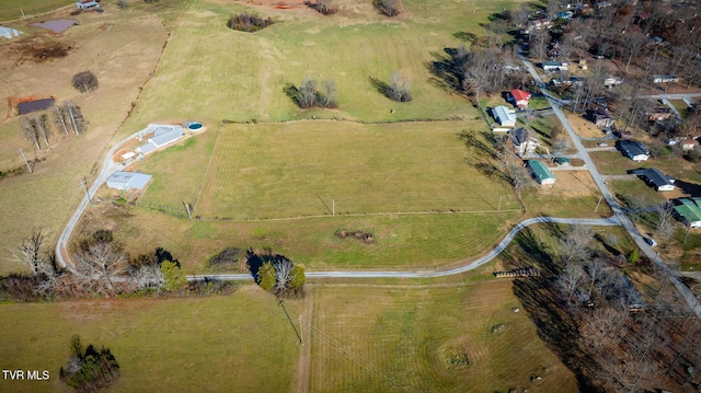 birds eye view of property featuring a rural view