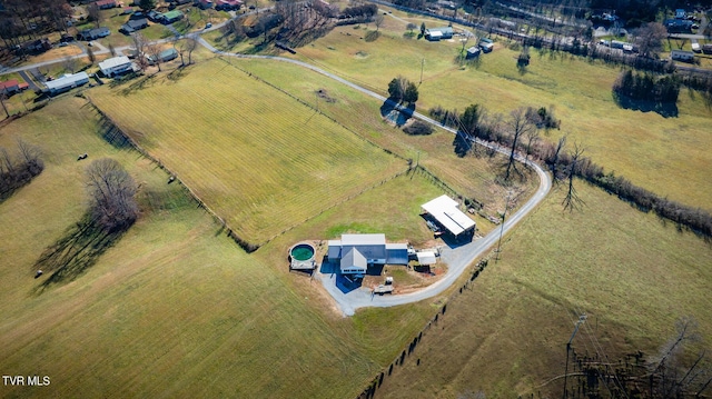 birds eye view of property featuring a rural view