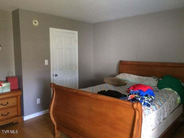 bedroom featuring dark hardwood / wood-style flooring