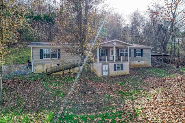 view of front of property with a carport