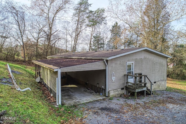 view of side of property with a carport