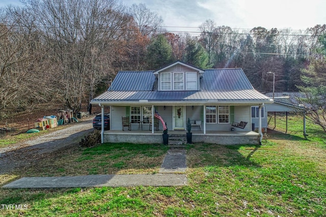 bungalow-style house featuring a front yard, a porch, and a carport