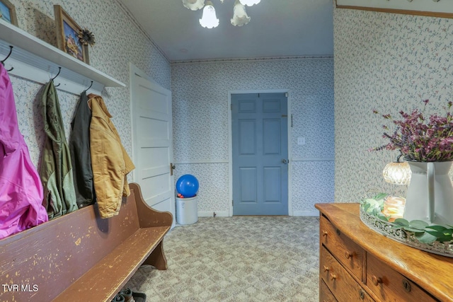 mudroom featuring crown molding