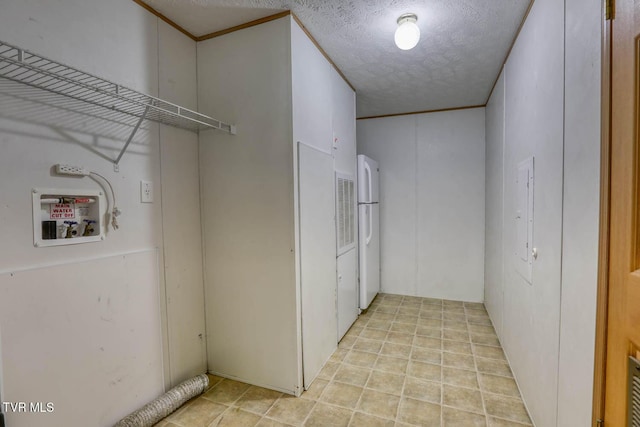 laundry area featuring hookup for a washing machine and a textured ceiling