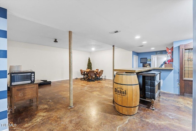 bar featuring concrete floors