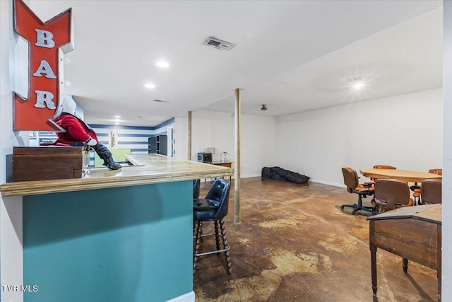 kitchen featuring a kitchen breakfast bar and kitchen peninsula