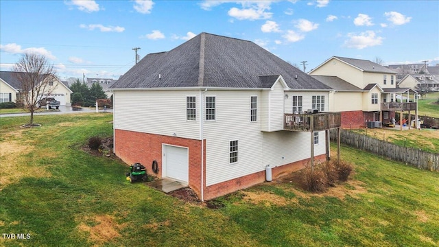 view of home's exterior featuring a garage, a yard, and a balcony