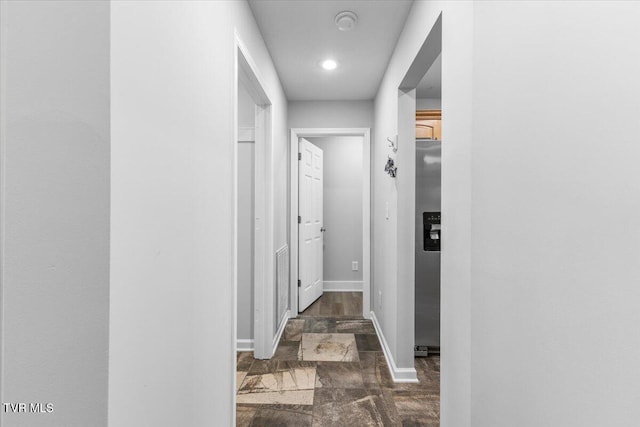 corridor featuring dark hardwood / wood-style flooring