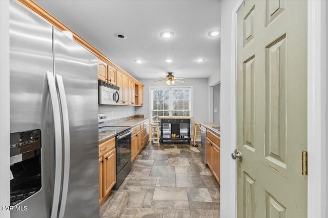 kitchen with stainless steel appliances and ceiling fan