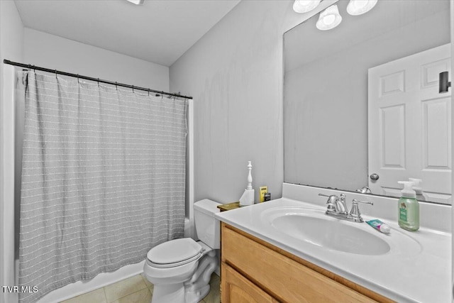 bathroom featuring tile patterned flooring, vanity, and toilet