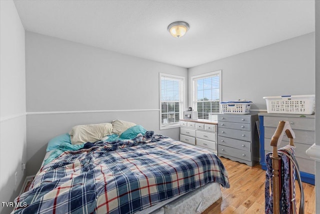 bedroom with light hardwood / wood-style floors