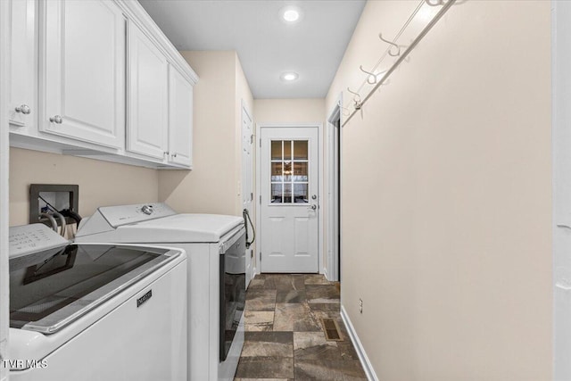 laundry area featuring cabinets and independent washer and dryer