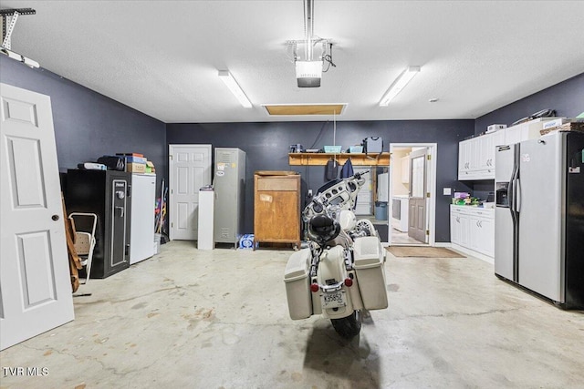 garage featuring a garage door opener and stainless steel refrigerator with ice dispenser