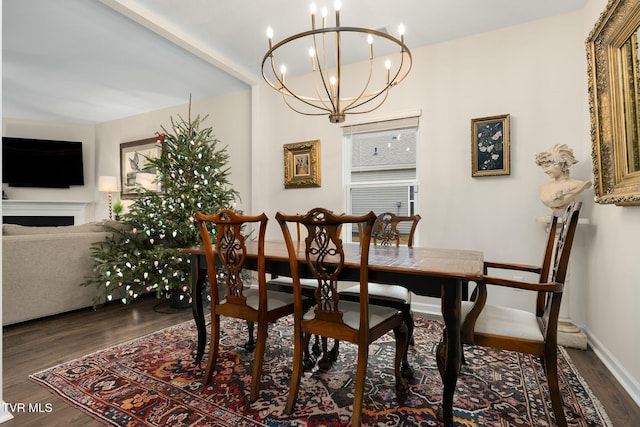 dining room with a chandelier and dark hardwood / wood-style floors