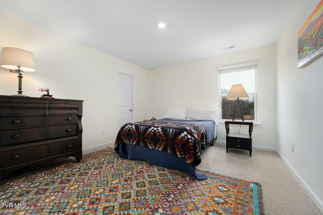 bedroom with light carpet