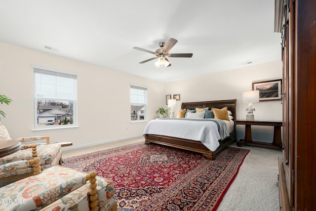 bedroom with ceiling fan and carpet flooring