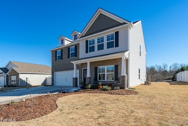 view of front of property featuring a front yard and a garage