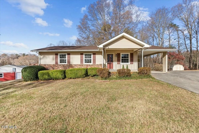 ranch-style house with a carport, a porch, an outdoor structure, and a front yard