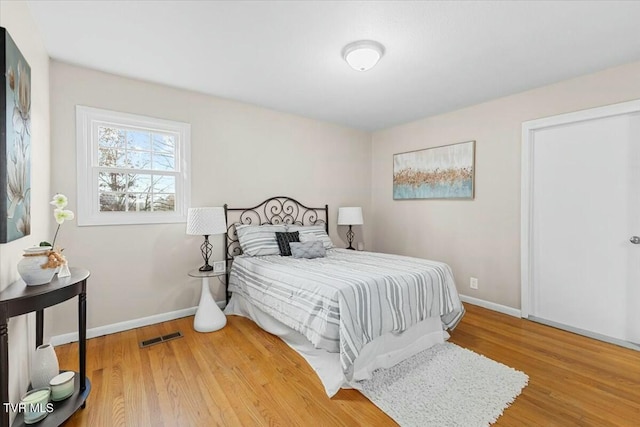 bedroom with light hardwood / wood-style floors