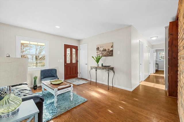 foyer entrance with hardwood / wood-style flooring