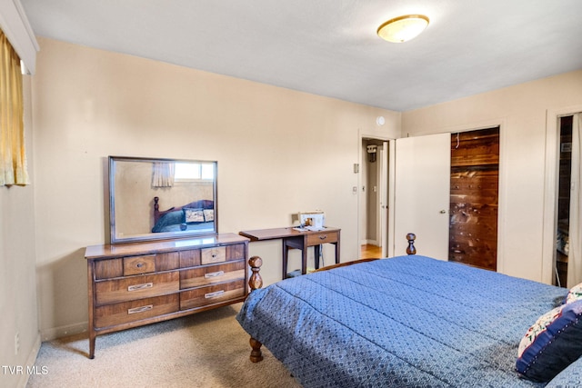 carpeted bedroom featuring a closet