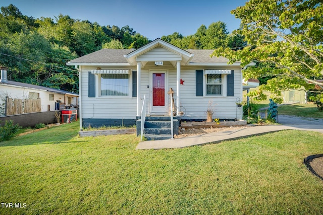 bungalow-style house featuring a front yard