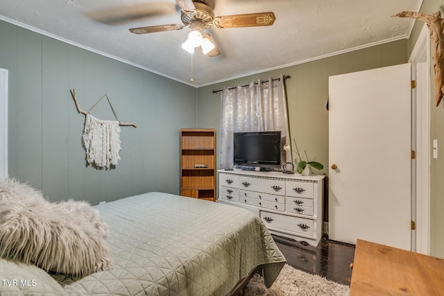 bedroom with ceiling fan, dark hardwood / wood-style floors, and ornamental molding