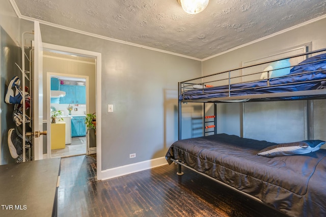 bedroom featuring hardwood / wood-style flooring, crown molding, and a textured ceiling